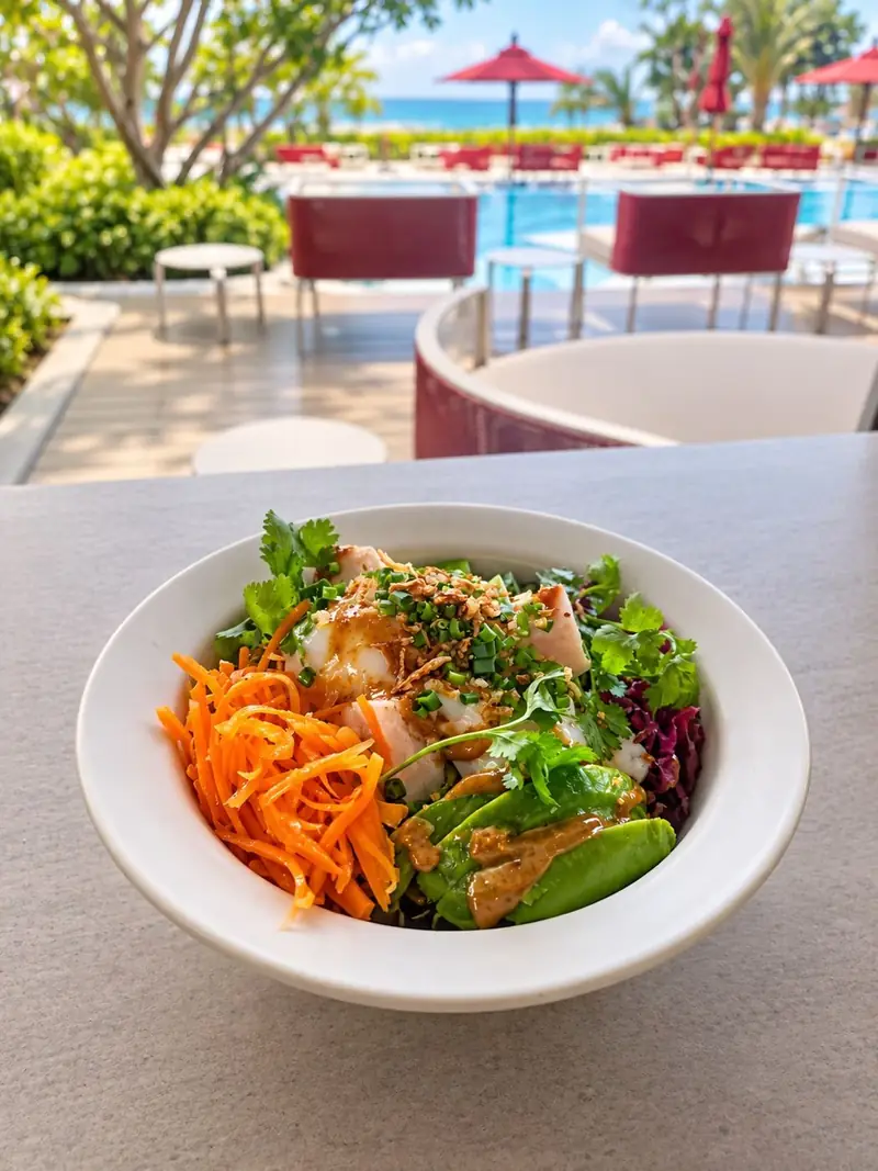 Asian chicken salad bowl by the pool